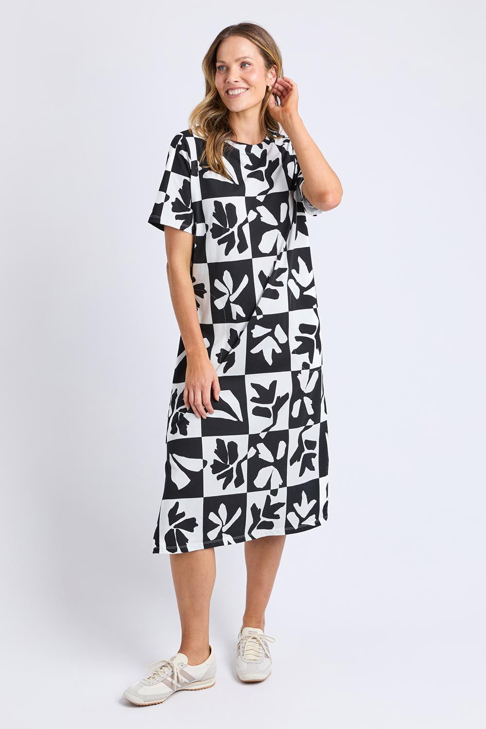 A model wearing the Splice Cotton Dress in colour Blackwhite, from the front, showing the whole outfit