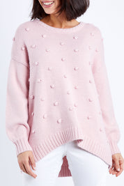 Model Andrea wearing size 10 of the Spot The Difference Knit in colour Dpink (Pink), from the front, cropped image