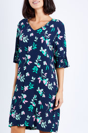 Model Andrea wearing size 10 of the Magnolia Shift Dress in colour Navy (Blue), from the front, cropped image
