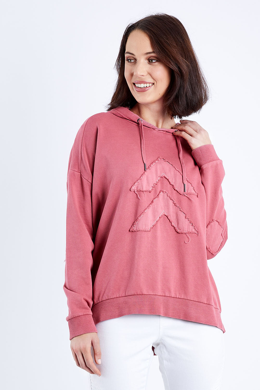 Model Andrea wearing size 10 of the Chevron Hoody in colour Drose (Pink), from the front, cropped image