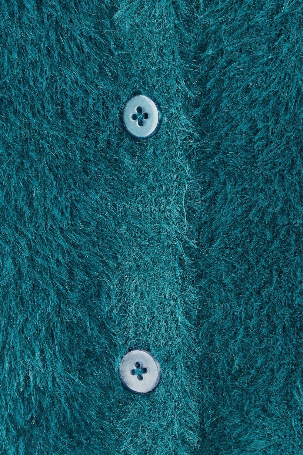 Product shot of the Paris Cardigan in colour Teal (Green), detail