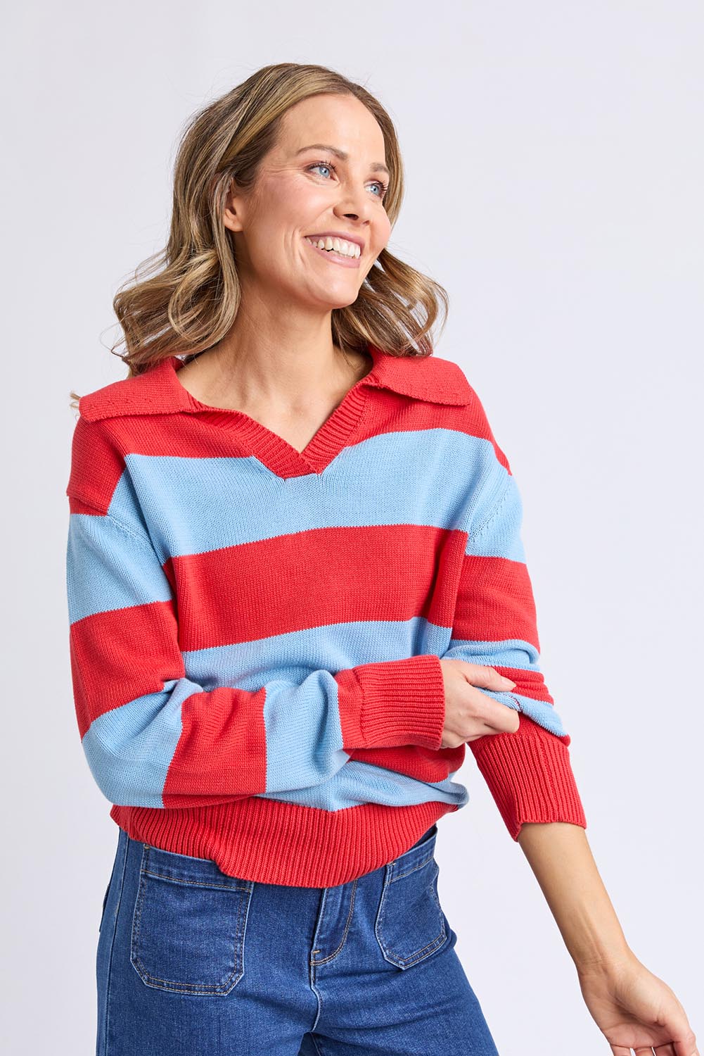 A model wearing the Striped Cotton Polo Knit in colour Brightred, from the front, cropped image