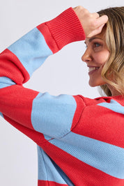 A model wearing the Striped Cotton Polo Knit in colour Brightred, from the front, cropped image