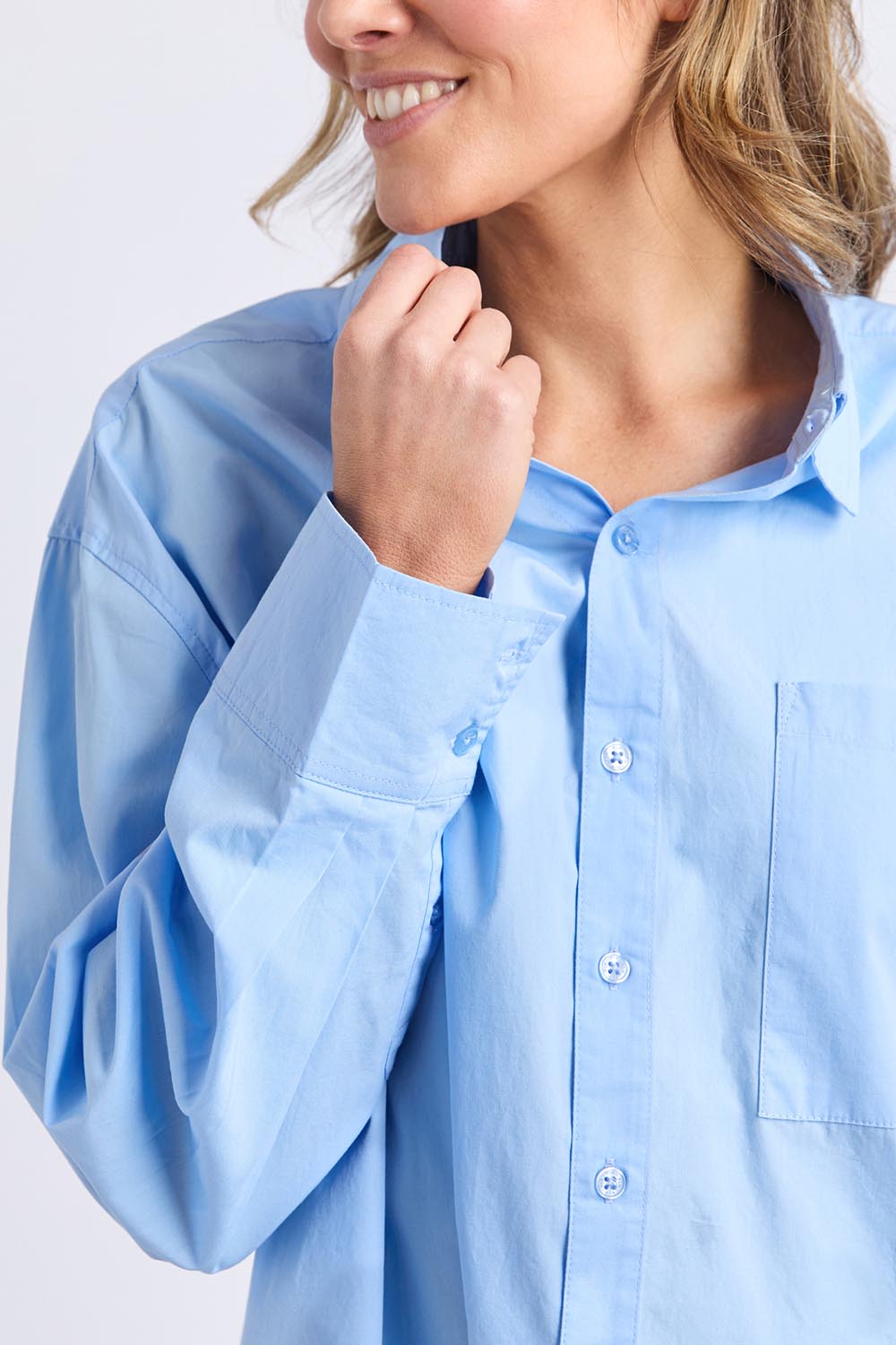 A model wearing the Sky Shirt in colour Lightblue (Blue), from the front, cropped image