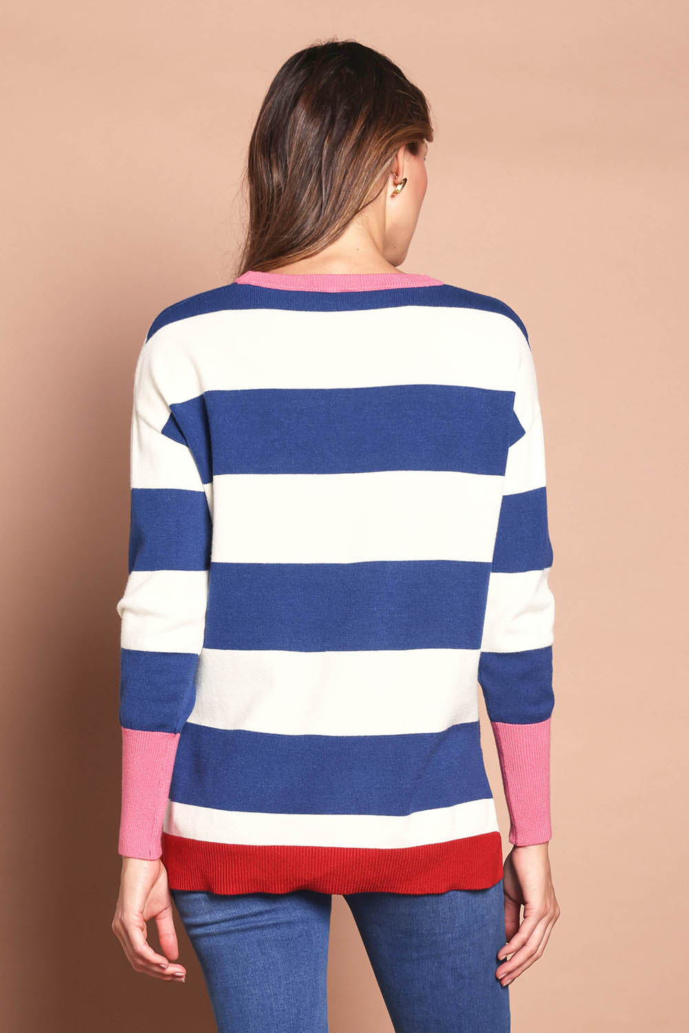 Model Madeline wearing size S of the Elvie Block Stripe Knit in colour Navystripe, from the back