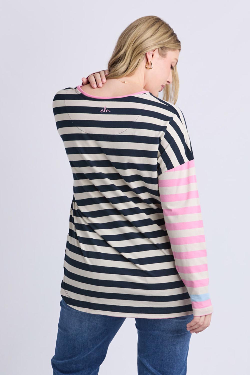 A model wearing the Gaeb Stripe Cotton Long Sleeve Tee in colour Whitenavy, from the back