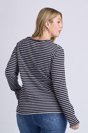 A model wearing the Drea Cotton Long Sleeve Tee in colour Navywhite, from the back