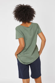 Model Olivia wearing size 10 of the Cross It Off SS Tee in colour Khaki (Green), from the back