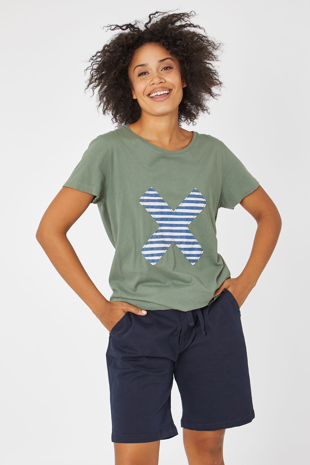 Model Olivia wearing size 10 of the Cross It Off SS Tee in colour Khaki (Green), from the front, cropped image