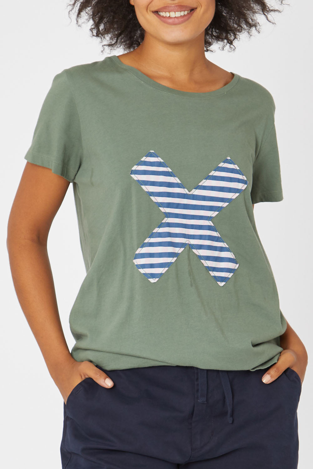 Model Olivia wearing size 10 of the Cross It Off SS Tee in colour Khaki (Green), from the front, cropped image