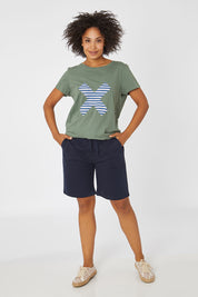 Model Olivia wearing size 10 of the Cross It Off SS Tee in colour Khaki (Green), from the front, showing the whole outfit