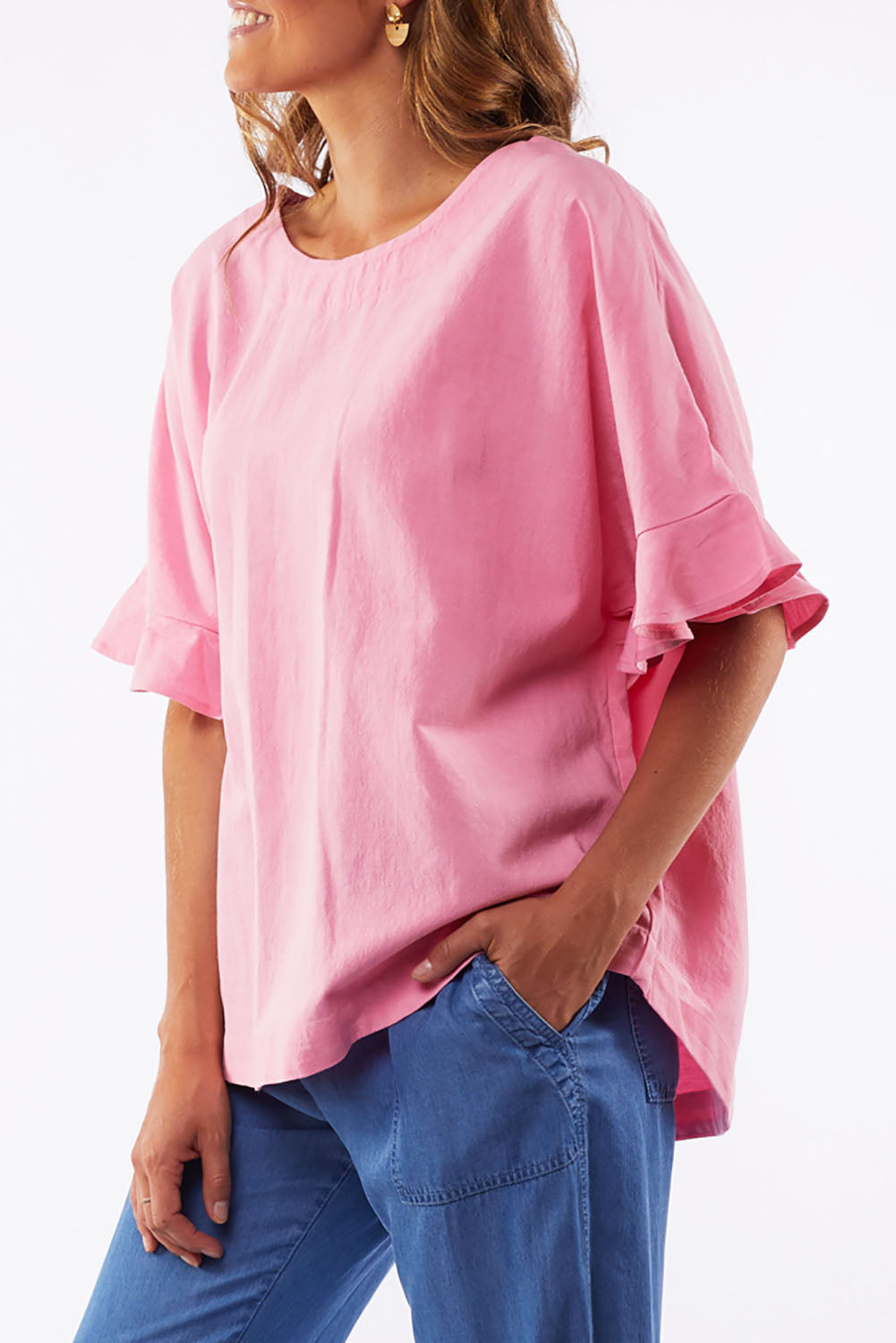 A model wearing the Miranda Top in colour Bubblep (Pink), from the front, cropped image