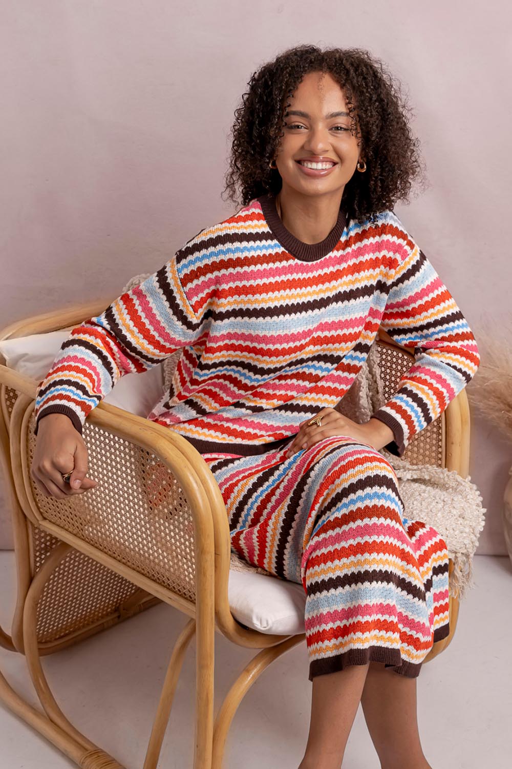 Model Genericm wearing size sample of the Retro Reef Long Sleeve Knit – Multi in colour Multi, from the front
