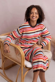 Model Genericm wearing size sample of the Retro Reef Long Sleeve Knit – Multi in colour Multi, from the front