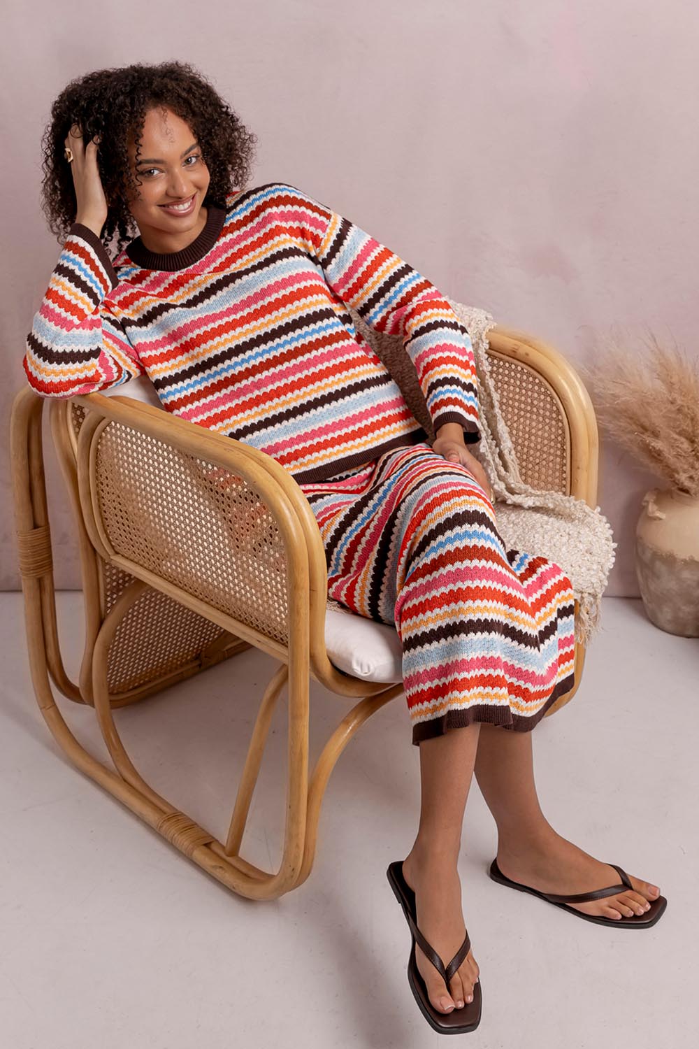 Model Genericm wearing size sample of the Retro Reef Knit Skirt – Multi in colour Multi, from the front