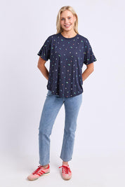 Model Genericm wearing size sample of the Festive Market Tee – Navy in colour Navy, from the front