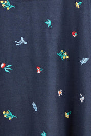 Product shot of the Festive Market Tee – Navy in colour Navy, showing detail