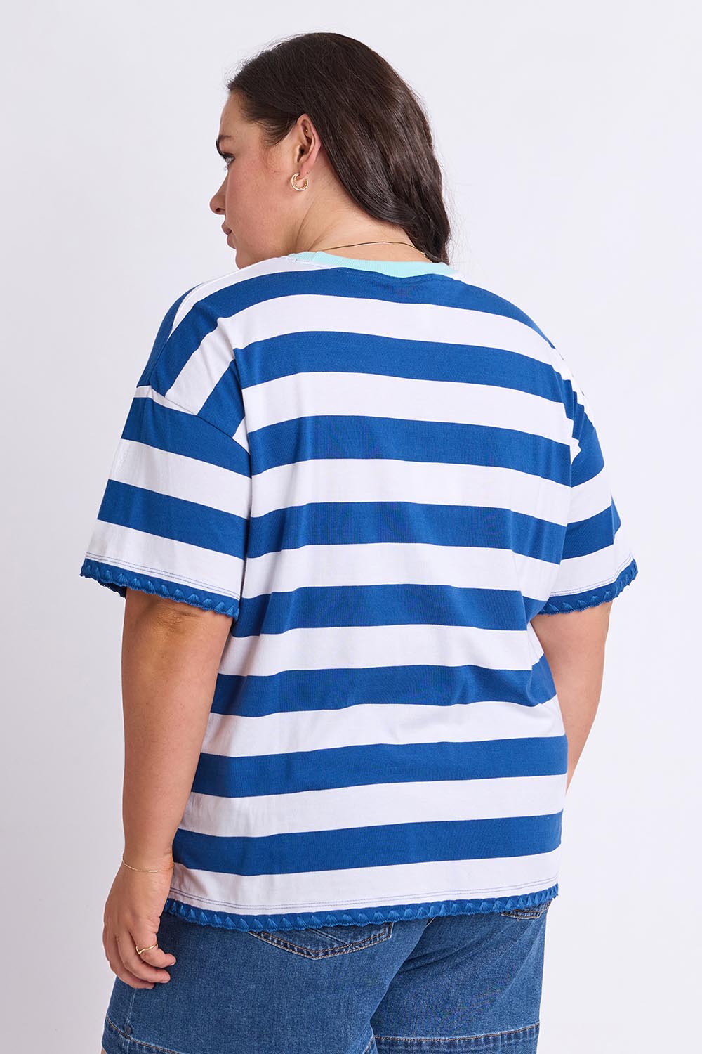 Model Genericm wearing size sample of the Cherry Tee – Chinablue in colour Chinablue, from the back
