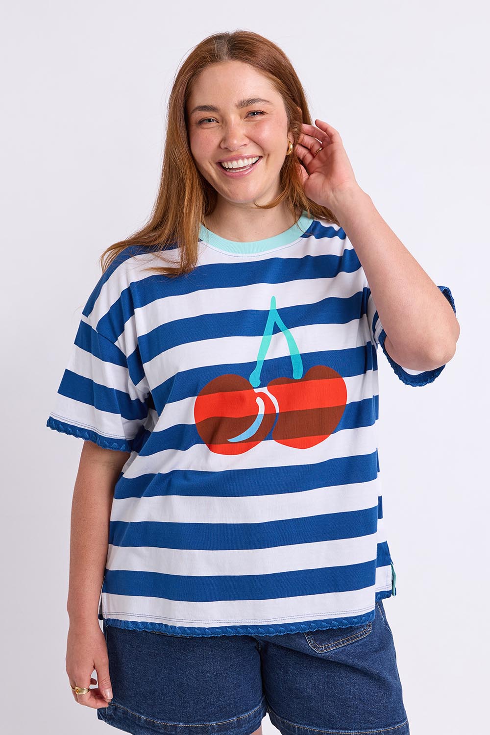 Model Genericm wearing size sample of the Cherry Cotton Tee – Chinablue in colour Chinablue, in a cropped view