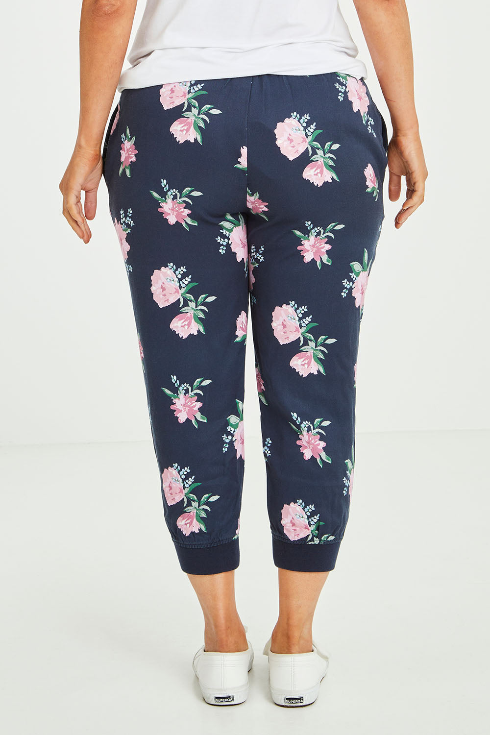 Model Laura wearing size 14 of the Primrose Pant in colour Navy (Blue), from the back