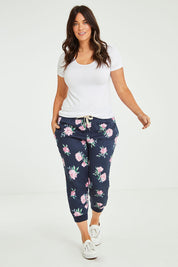 Model Laura wearing size 14 of the Primrose Pant in colour Navy (Blue), from the front, showing the whole outfit