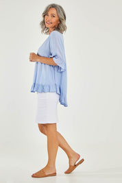 Model Luisa wearing size 10 of the Kiara Top in colour Skyblue (Blue), from the front, showing the whole outfit