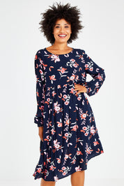 Model Olivia wearing size 10 of the Sloanne Floral Dress in colour Navy (Blue), from the front, cropped image