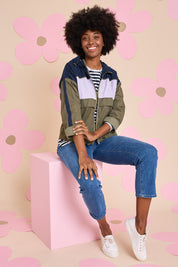 Model Aiyana wearing size S of the Laura Spray Jacket in colour Khaki (Green), from the front, showing the whole outfit