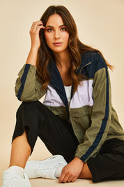 Model Madeline wearing size S of the Laura Spray Jacket in colour Khaki (Green), from the front, showing the whole outfit