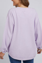 A model wearing the Piper Sweat in colour Lilac (Purple), from the back
