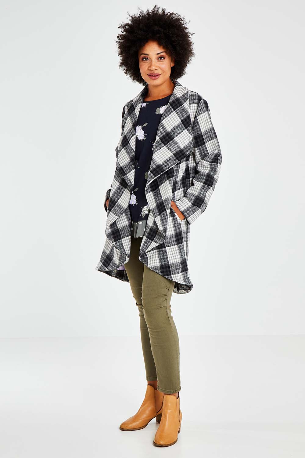 Model Olivia wearing size S of the Cindy Check Coat in colour Charcoal (Grey), from the front, showing the whole outfit