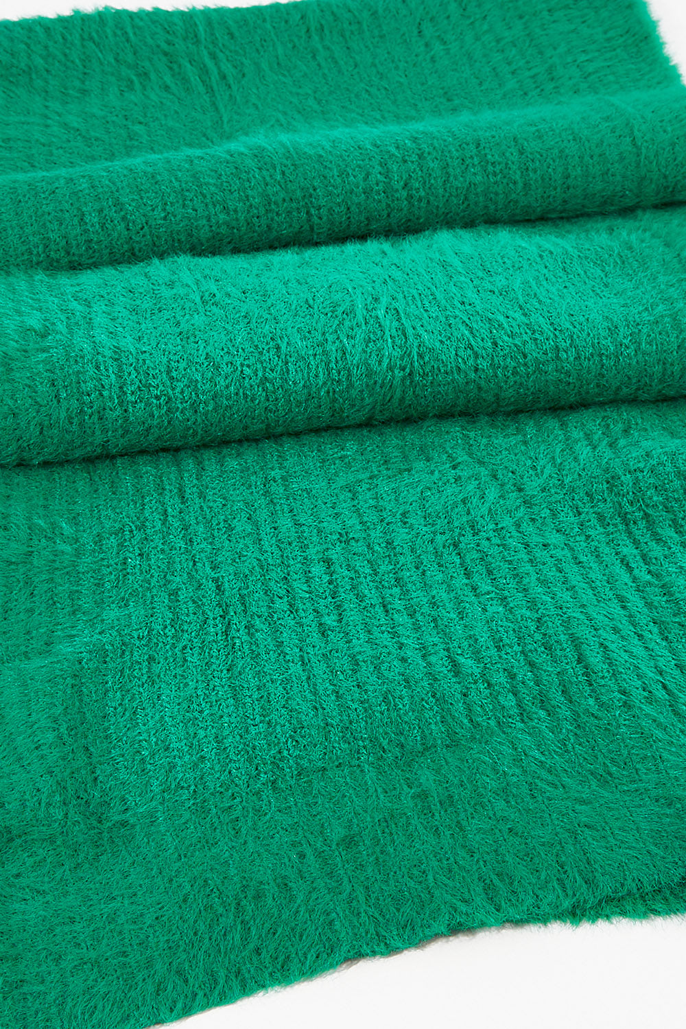A model wearing size OneSize of the Snug Scarf in colour Wintgreen (Green), from the front, showing the whole outfit