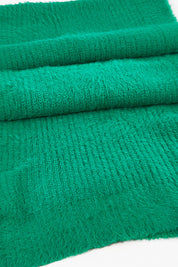 A model wearing size OneSize of the Snug Scarf in colour Wintgreen (Green), from the front, showing the whole outfit
