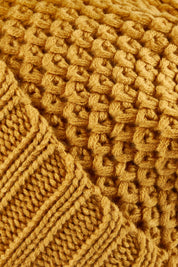 Product shot of the Berry Beanie in colour Mustard, detail