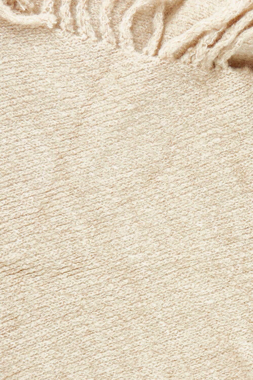 Product shot of the Fringed Triangle Scarf in colour Oatmeal, detail