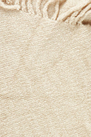 Product shot of the Fringed Triangle Scarf in colour Oatmeal, detail