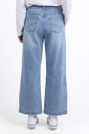 A model wearing the Izzy Wide Leg Jean in colour Lightblue (Blue), from the back
