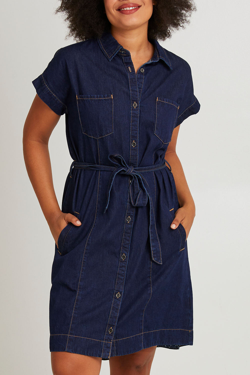 Model Olivia wearing size 10 of the Everleigh Denim Dress in colour Drkwash (Blue), from the front, cropped image