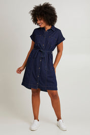 Model Olivia wearing size 10 of the Everleigh Denim Dress in colour Drkwash (Blue), from the front, showing the whole outfit