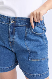 A model wearing the Fundamental Atlas Denim Short in colour Darkblue (Blue), from the front, cropped image