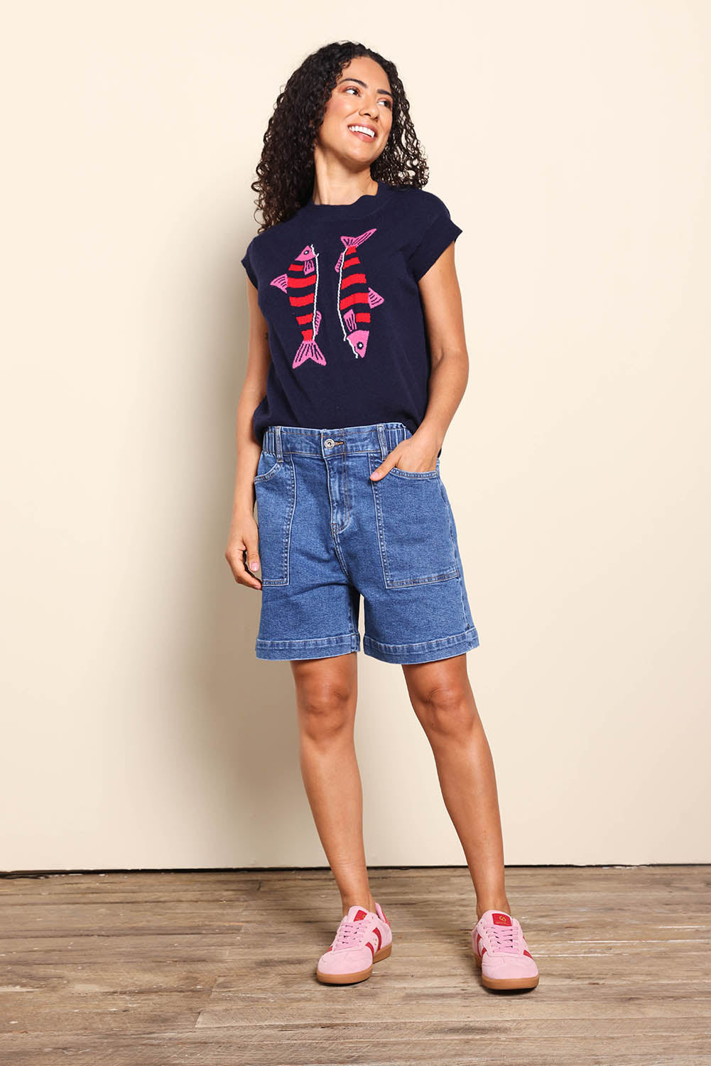 Model Pamelar wearing size 10 of the Fundamental Atlas Denim Short - Darkblue in colour Darkblue, from the front