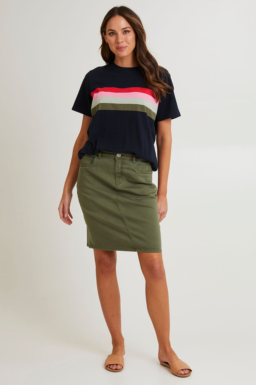 Model Madeline wearing size 10 of the Belle Denim Skirt in colour Washekhaki (Green), from the front, showing the whole outfit