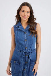 A model wearing the Daisy Denim Dress in colour Bluewash (Blue), from the front, cropped image