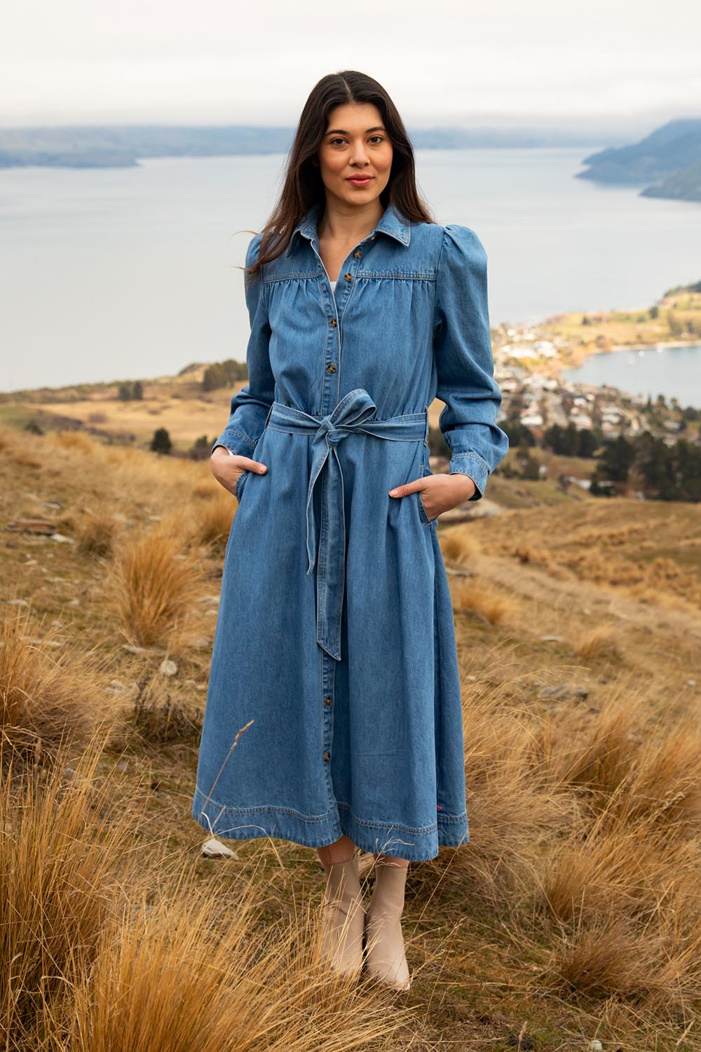 A model wearing the Lucinda Denim Shirt Dress in colour Denim (Blue), from the front, showing the whole outfit