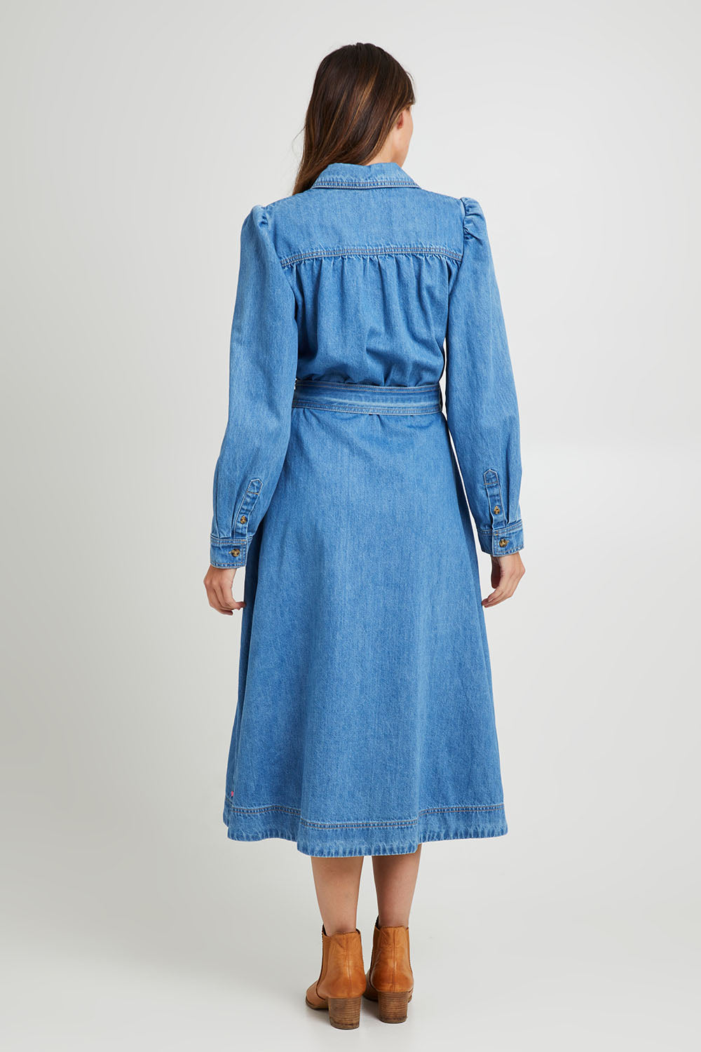 Model Madeline wearing size 10 of the Lucinda Denim Shirt Dress in colour Denim (Blue), from the back