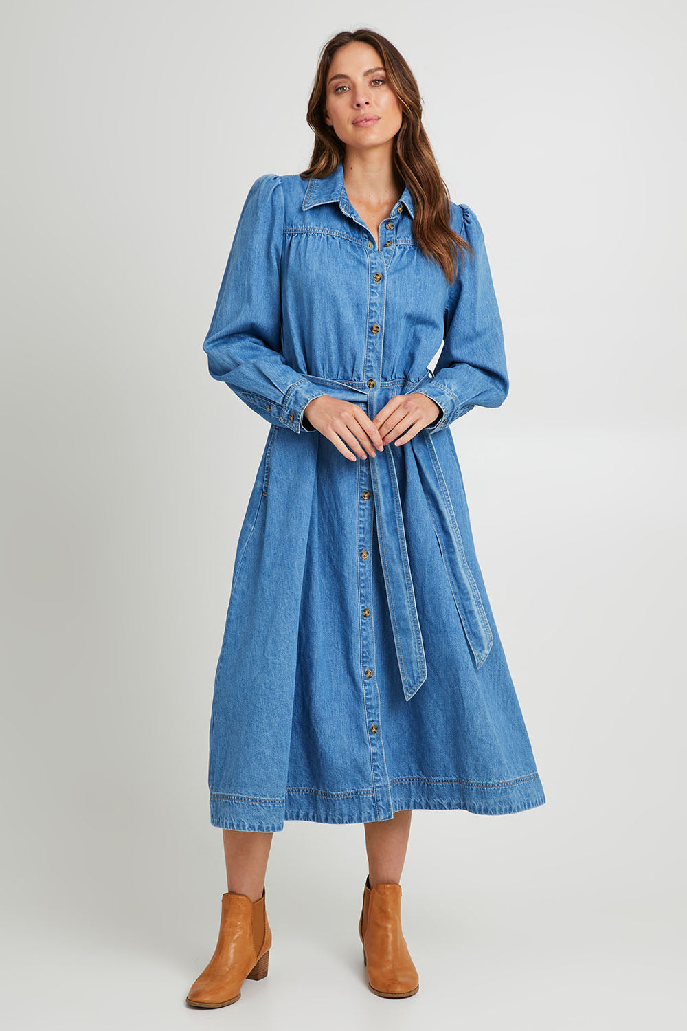 Model Madeline wearing size 10 of the Lucinda Denim Shirt Dress in colour Denim (Blue), from the front, showing the whole outfit