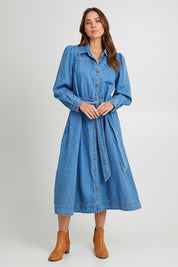 Model Madeline wearing size 10 of the Lucinda Denim Shirt Dress in colour Denim (Blue), from the front, showing the whole outfit