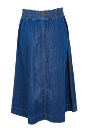 Product shot of the Fundamental Greta Denim Skirt in colour Darkblue (Blue), from the back