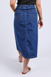 A model wearing the Scallop Edge Denim Skirt in colour Midblue (Blue), from the back
