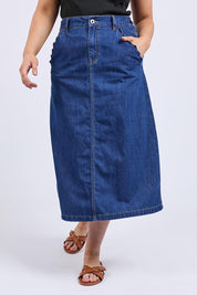 A model wearing the Scallop Edge Denim Skirt in colour Midblue (Blue), from the front, cropped image